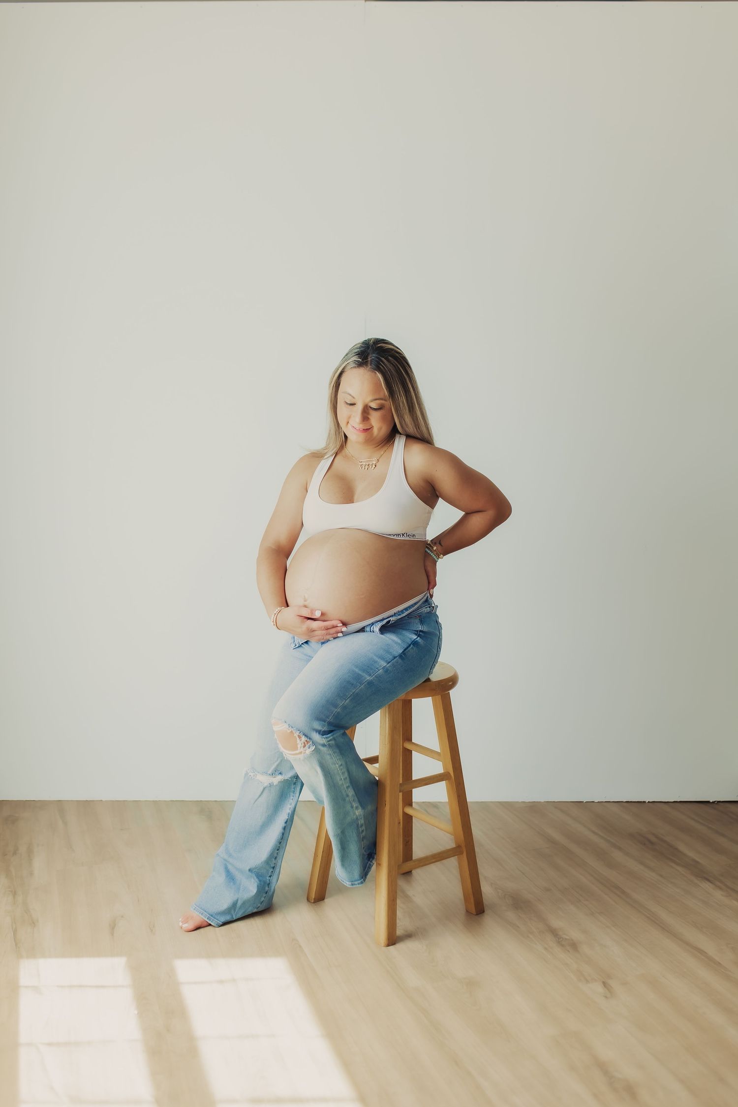 Maternity photo during indoor maternity session in Wimbledon.