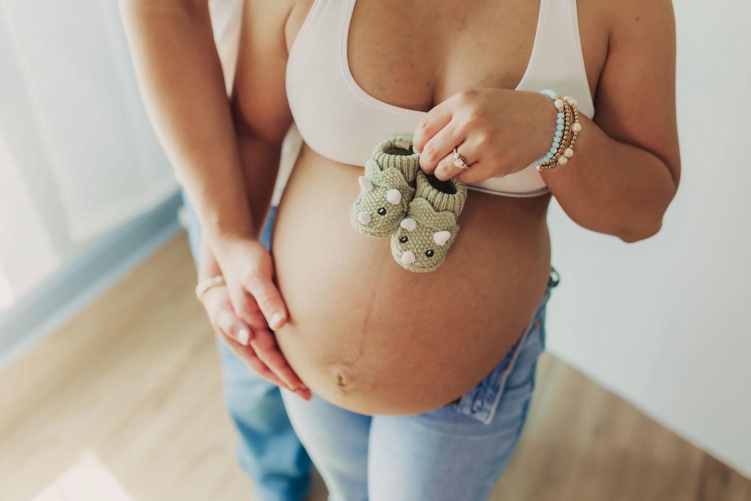 Up-close maternity photo during indoor maternity session in Wimbledon.