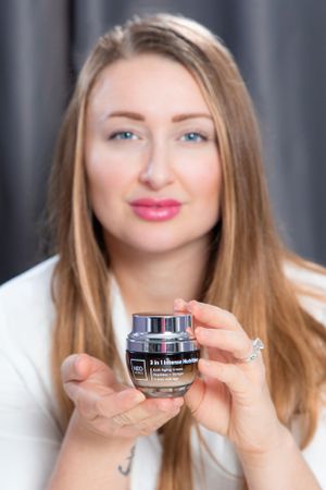 Product photography series showing cosmetic cream jar with model in white shirt.