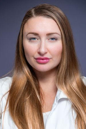 Beauty portraits with natural makeup look against dark blue studio background.