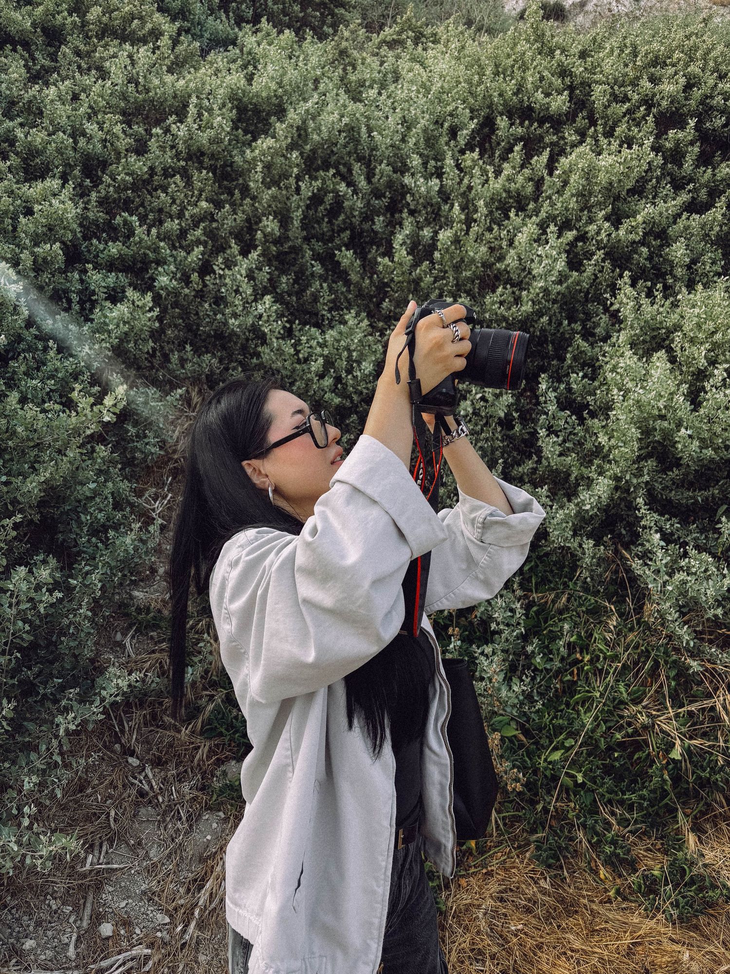 Felix photographing a couple outdoors, capturing a real moment while working quietly and candidly