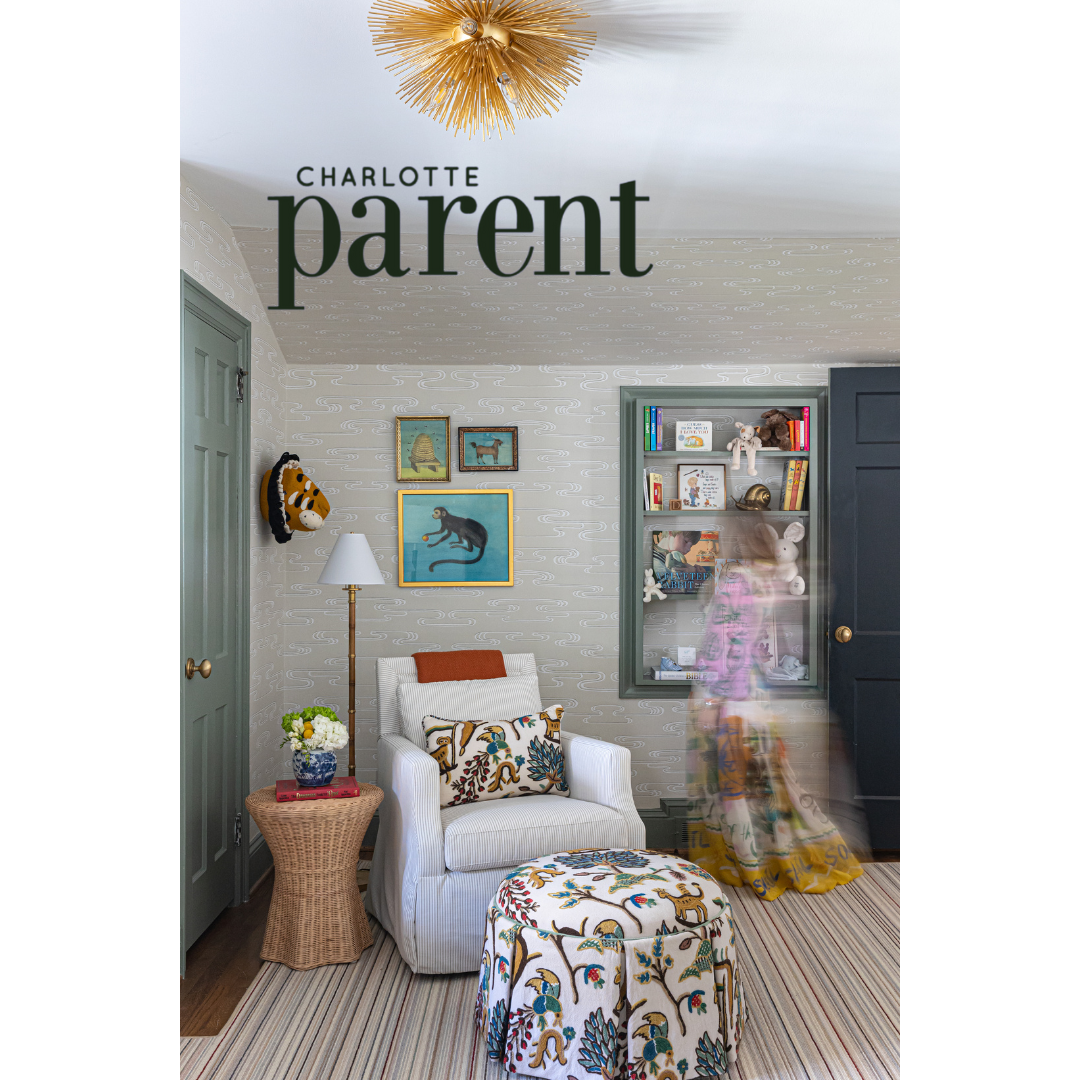 Heather Ison Photography for Charlotte Parent. Charming nursery with striped carpet, comfortable armchair, and whimsical wall decor.