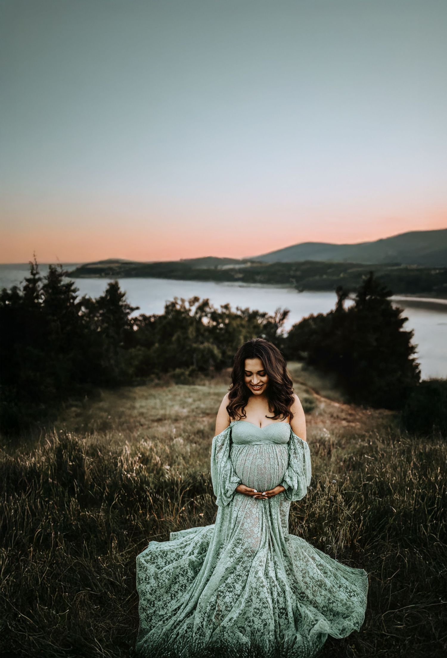 Moody maternity photo at Grapevine Lake with fog in background taken by april pinto photography