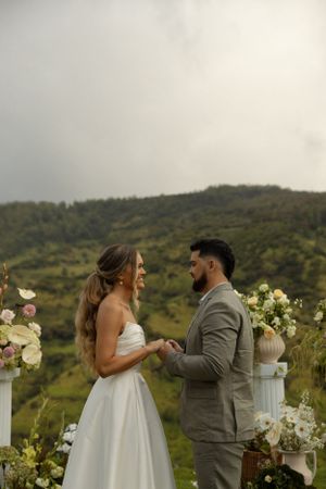 A couple sharing an intimate moment during their mountain wedding ceremony.