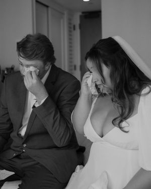 An emotional moment shared between a couple during their wedding ceremony.
