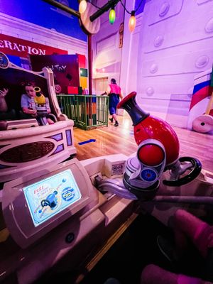 Modern plush toy themed interiors with curved walls and colorful lighting create a whimsical retail space.