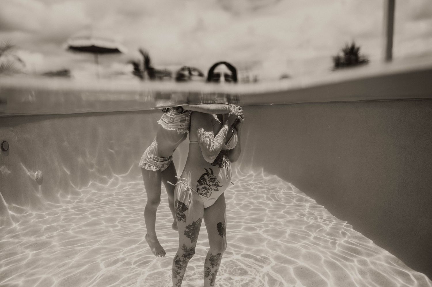 Sunshine Coast Underwater Maternity Photographer in the ocean and beach number 1 blue waters and sky
