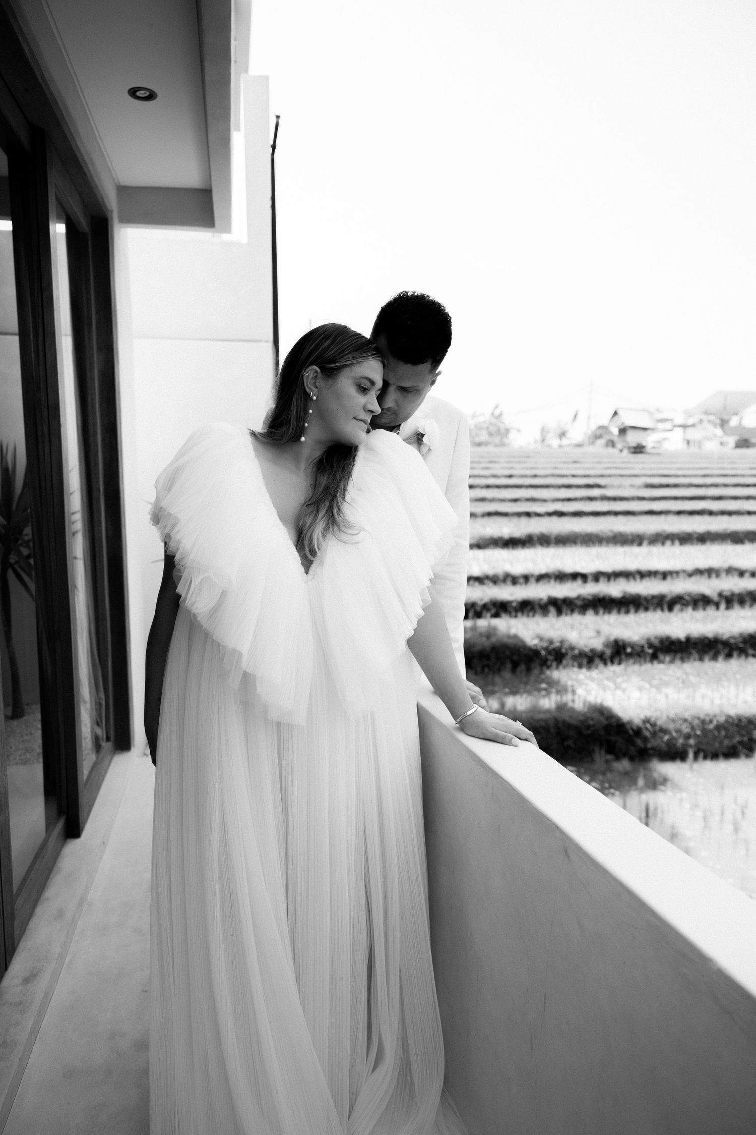 A black and white romantic wedding portrait overlooking rice terraces.