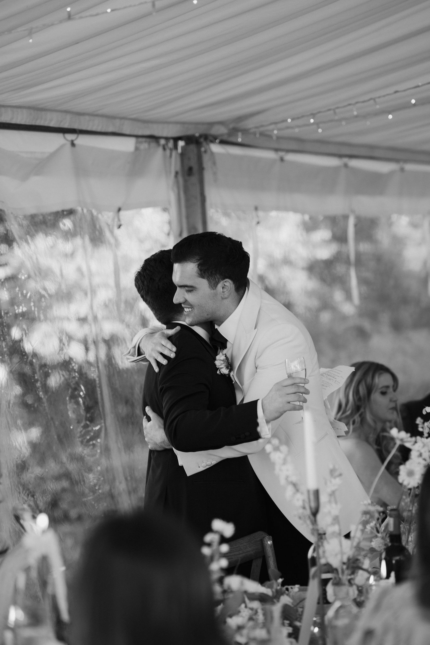 groom and best man embracing in a hug at hamswell house wedding in bath