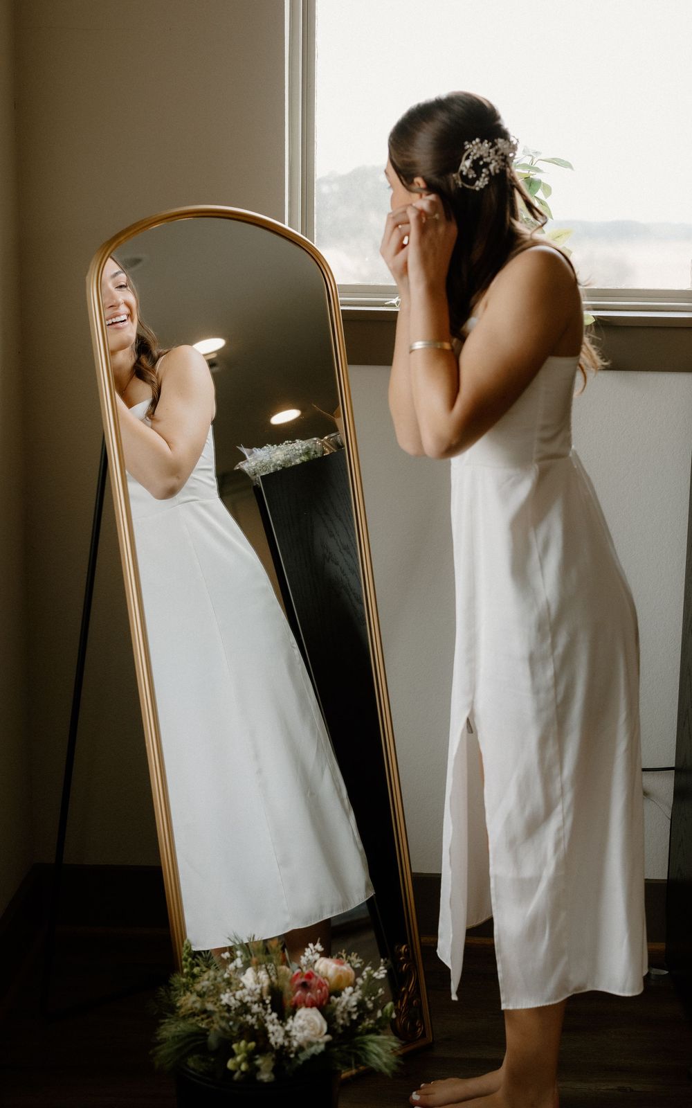 A series of artistic mirror reflections showing a person in a white dress against a minimalist interior setting.