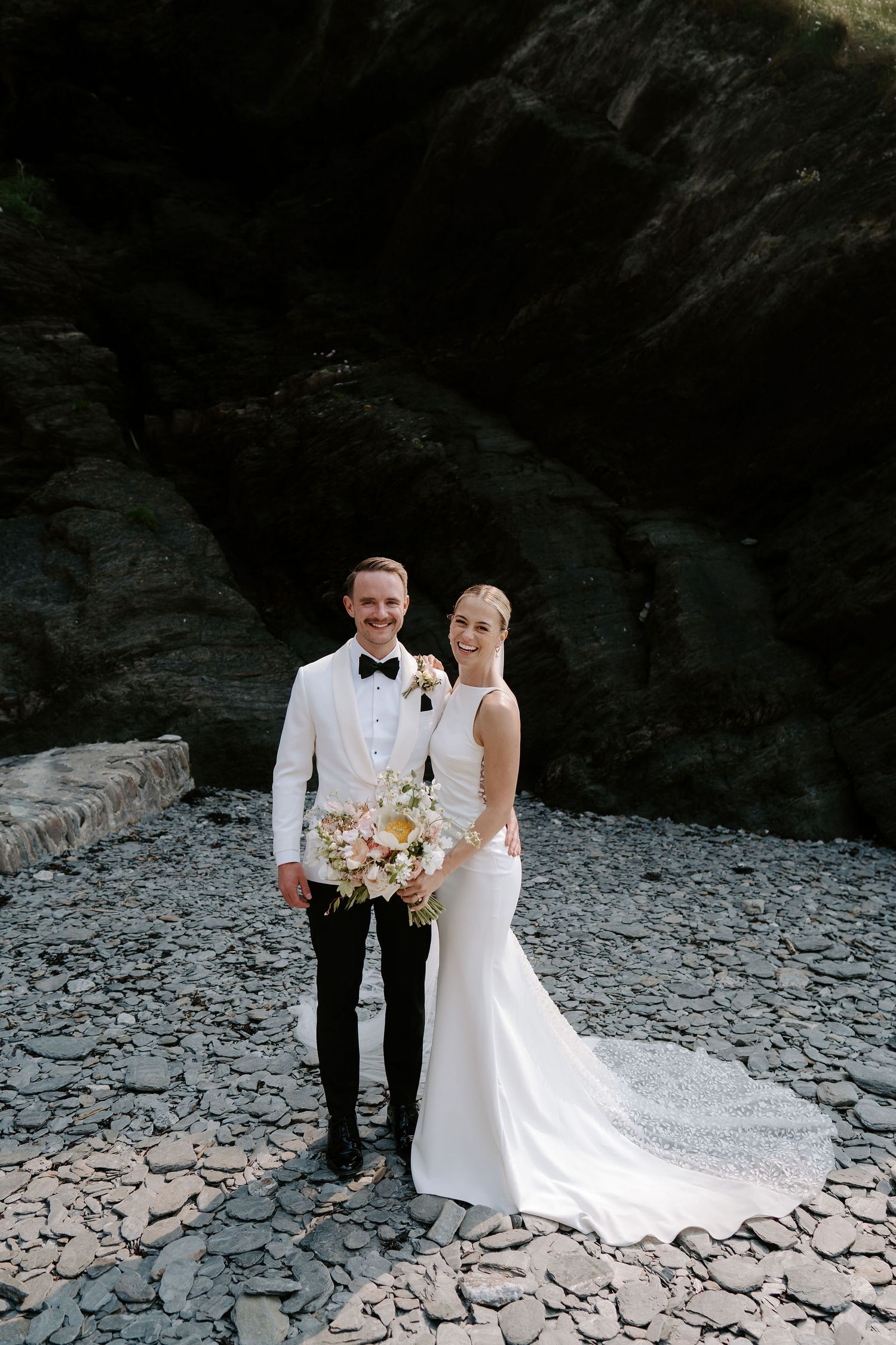 Bride and Groom on beach at Tunnels beach wedding venue in north devon