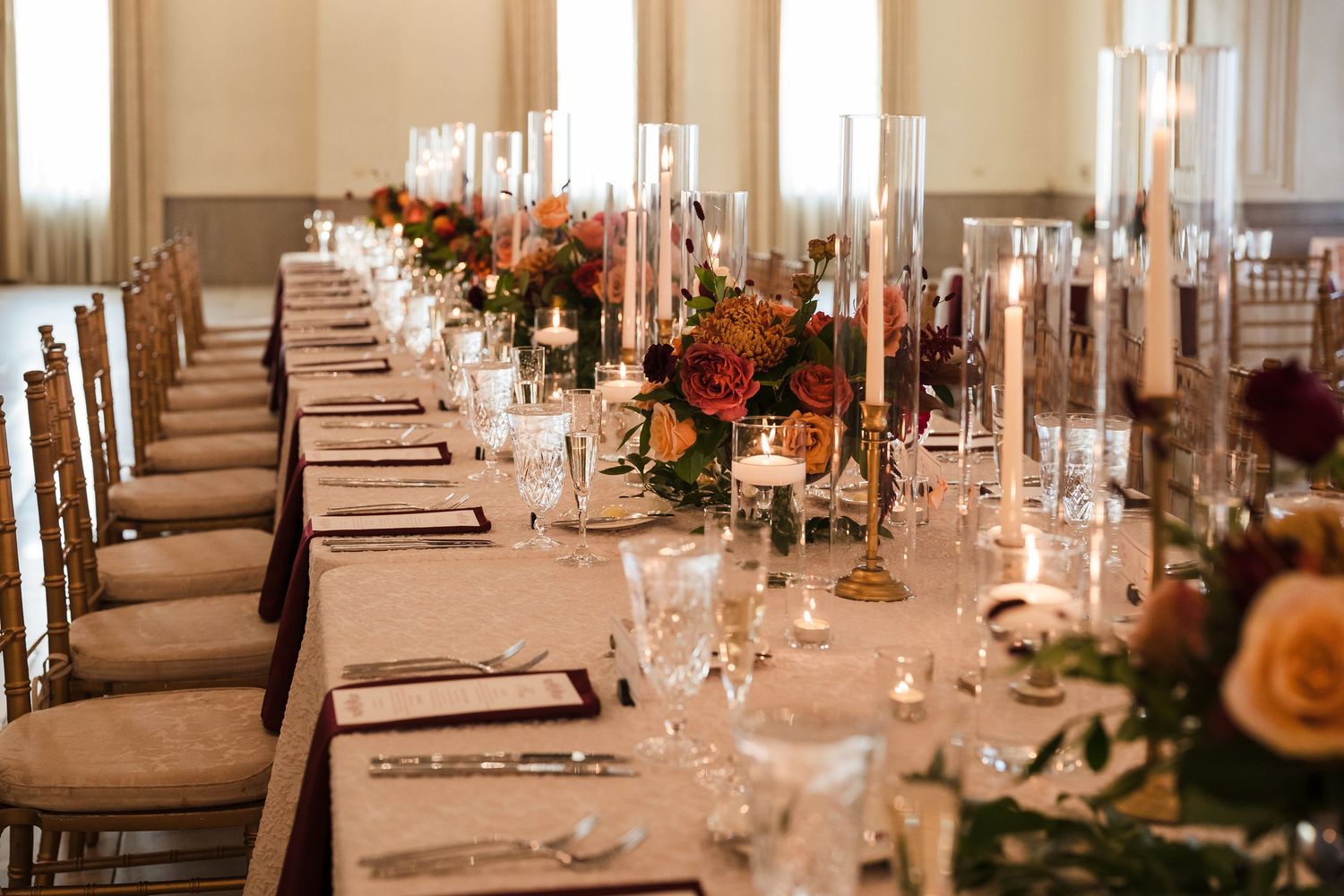 Elegant table settings with crystal glassware and floral centerpieces at formal wedding reception at Columbus Ohio Wedding Venues