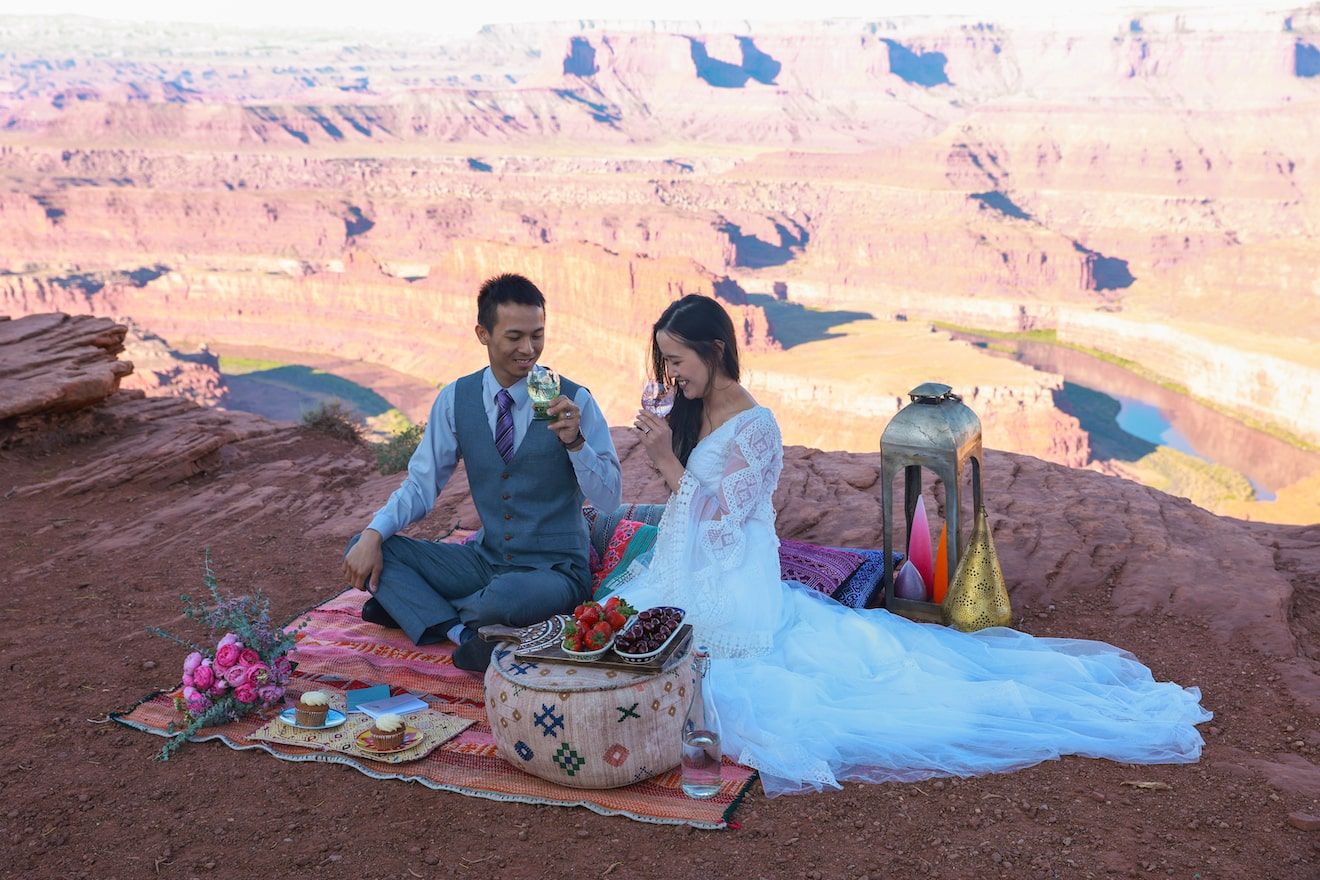 couple having a picnic on their elopement in moab