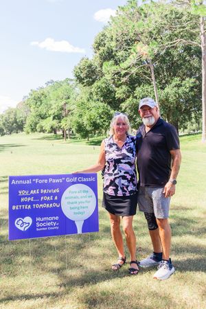 Charity golf event banner display for the Annual Fore Paws Golf Classic supporting Humane Society.