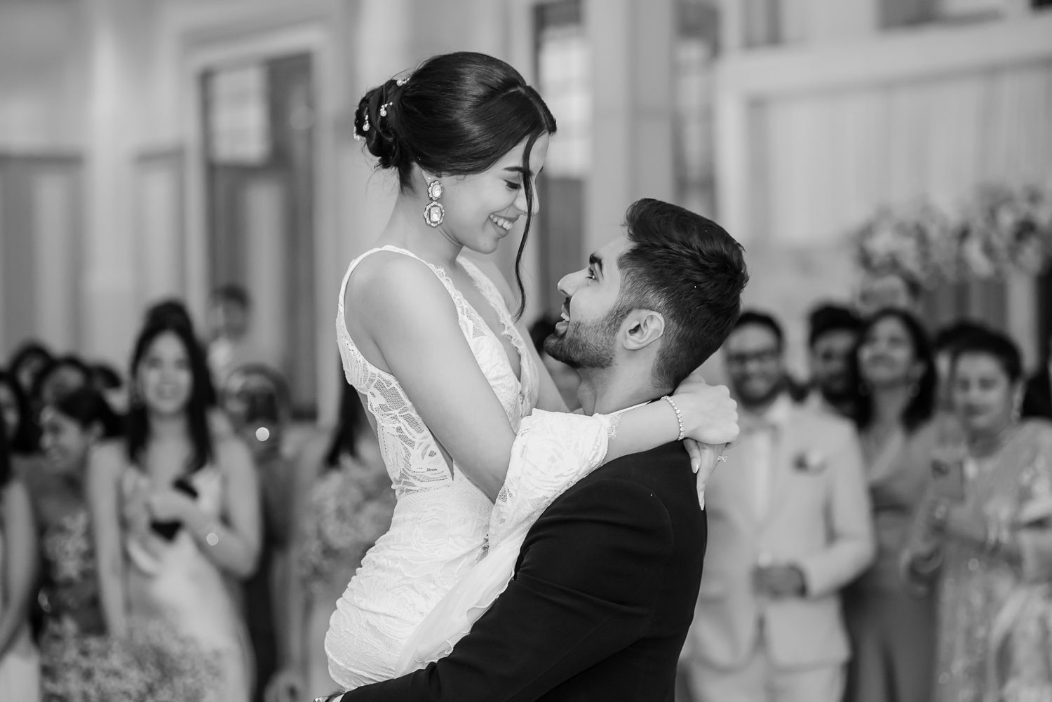 Newlyweds Shorye and Leah enjoying their first dance surrounded by loved ones, after the christian wedding ceremony at Tivoli Chattarpur