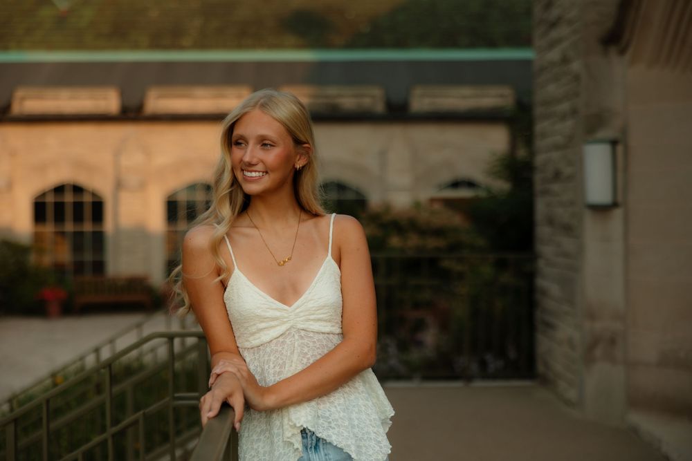A bride in a white dress poses outdoors in multiple candid shots at a rustic venue.