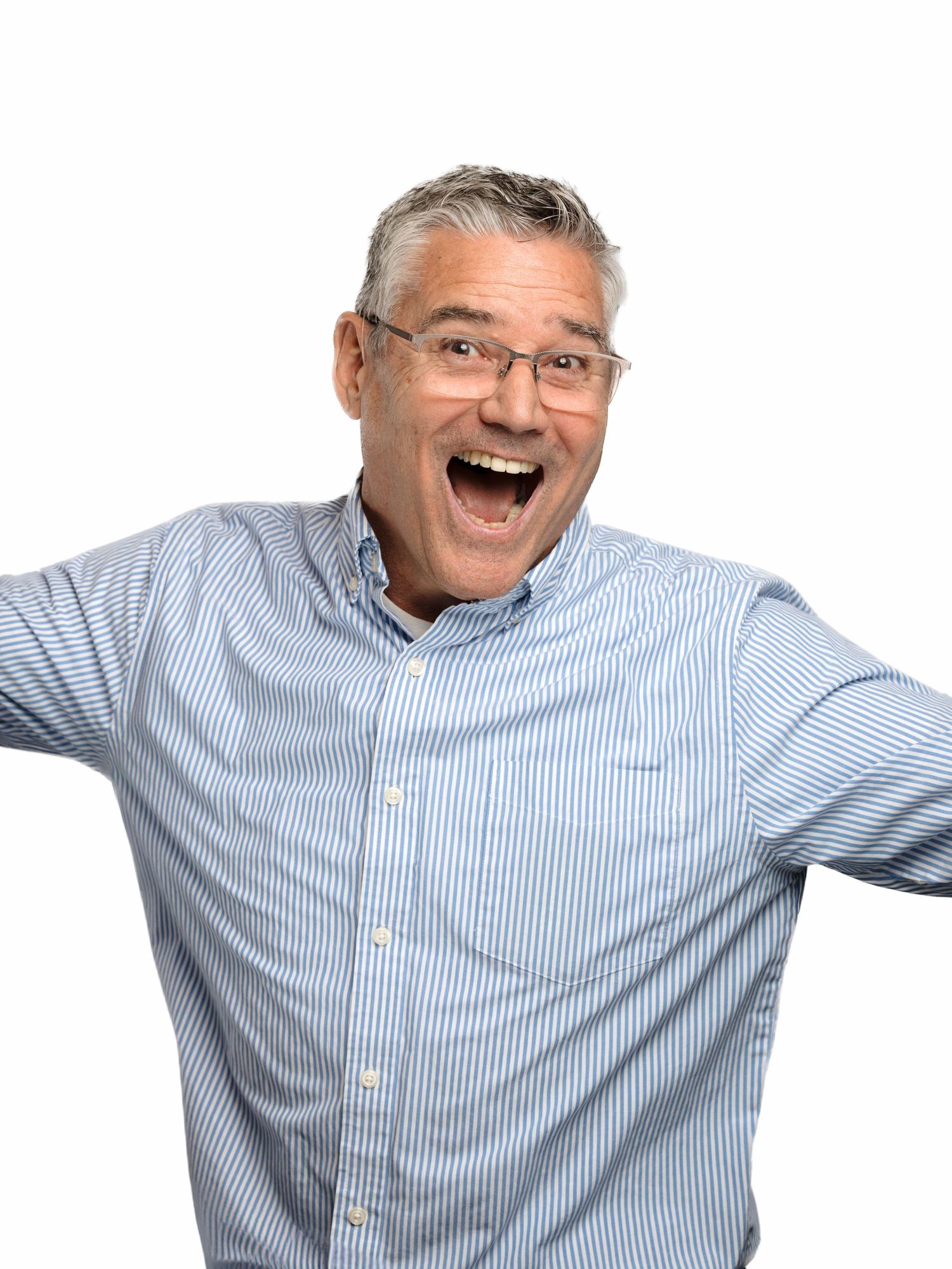 Elderly person in blue striped button-down shirt laughing and making expressive gestures against white background.