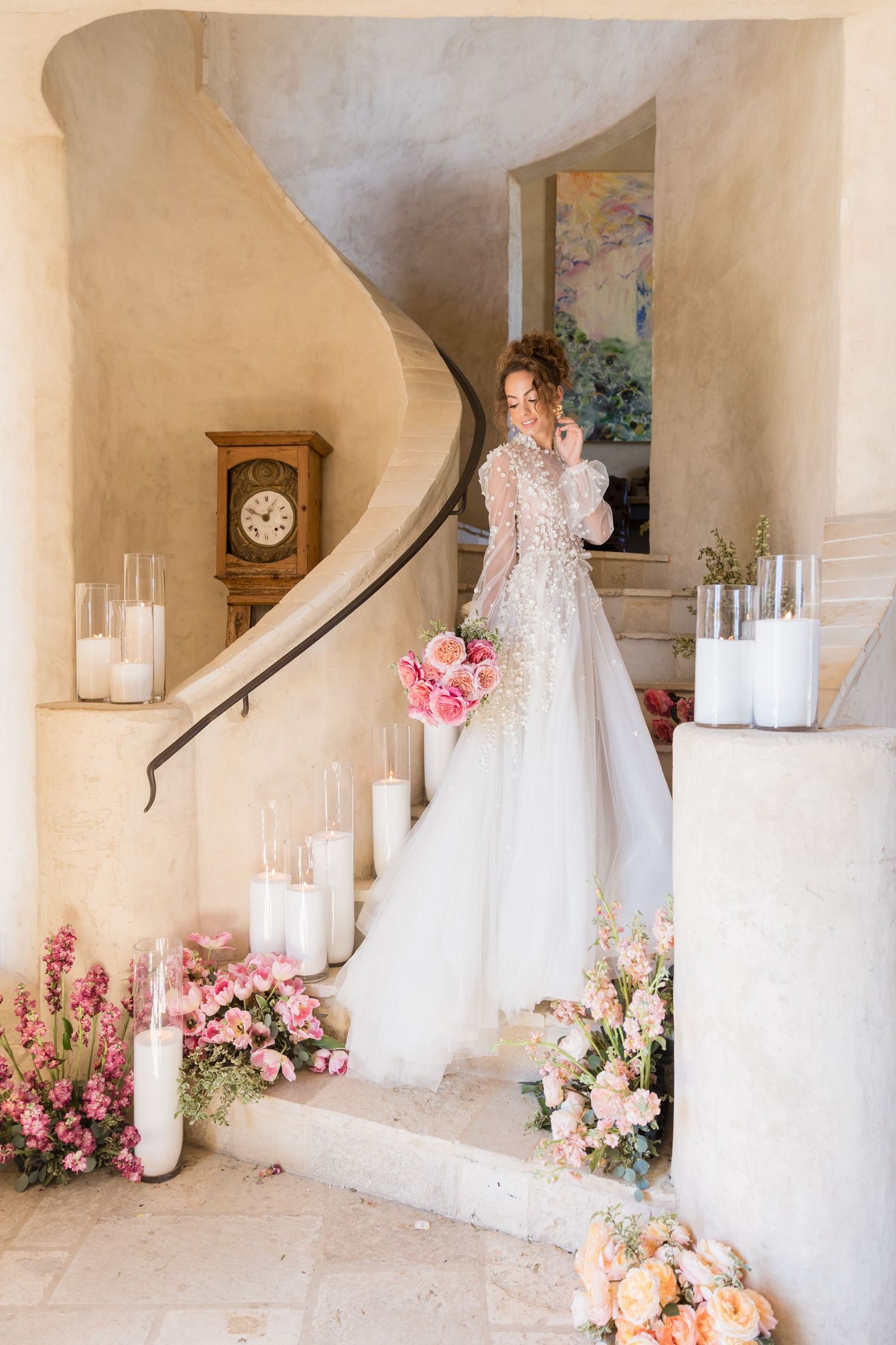 A collection of elegant white wedding dresses displayed in a sunlit room with beige curtains and wooden floors.