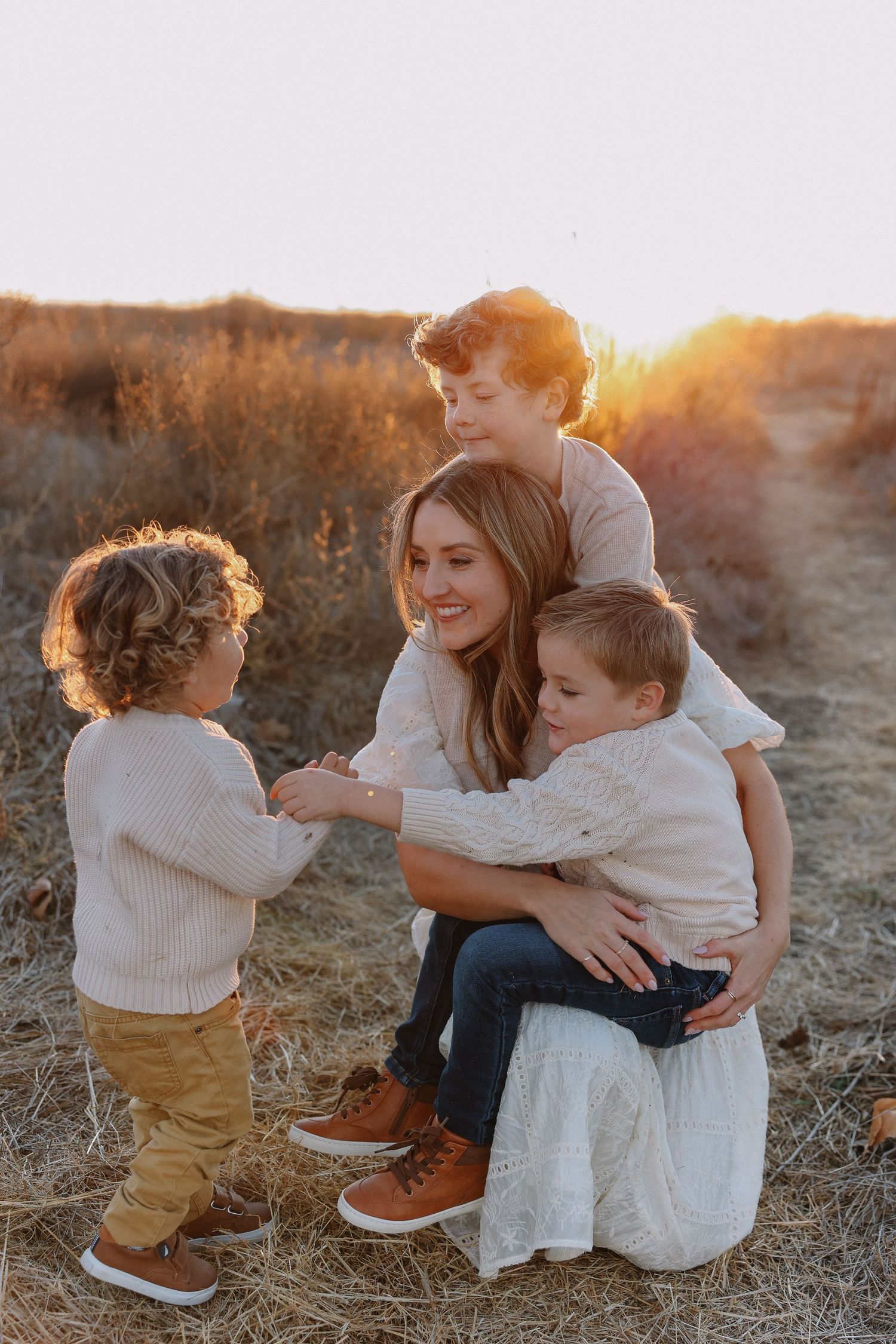 Outdoor California family photography with mom and kids sharing laughter