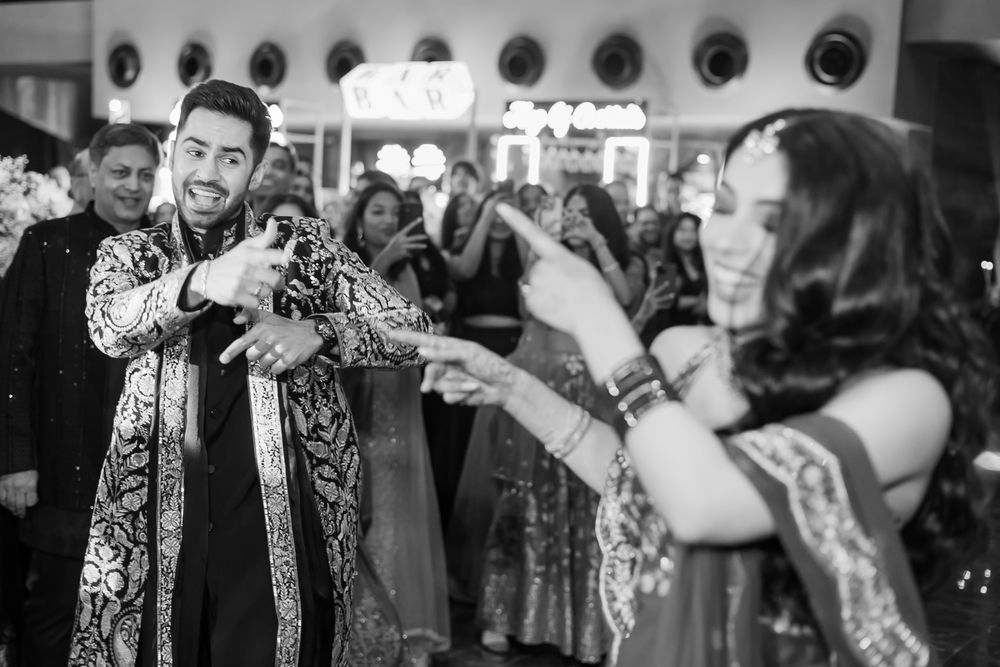 Shorye and Leah at their high-energy Indian wedding Sangeet celebration at Tivoli Chattarpur