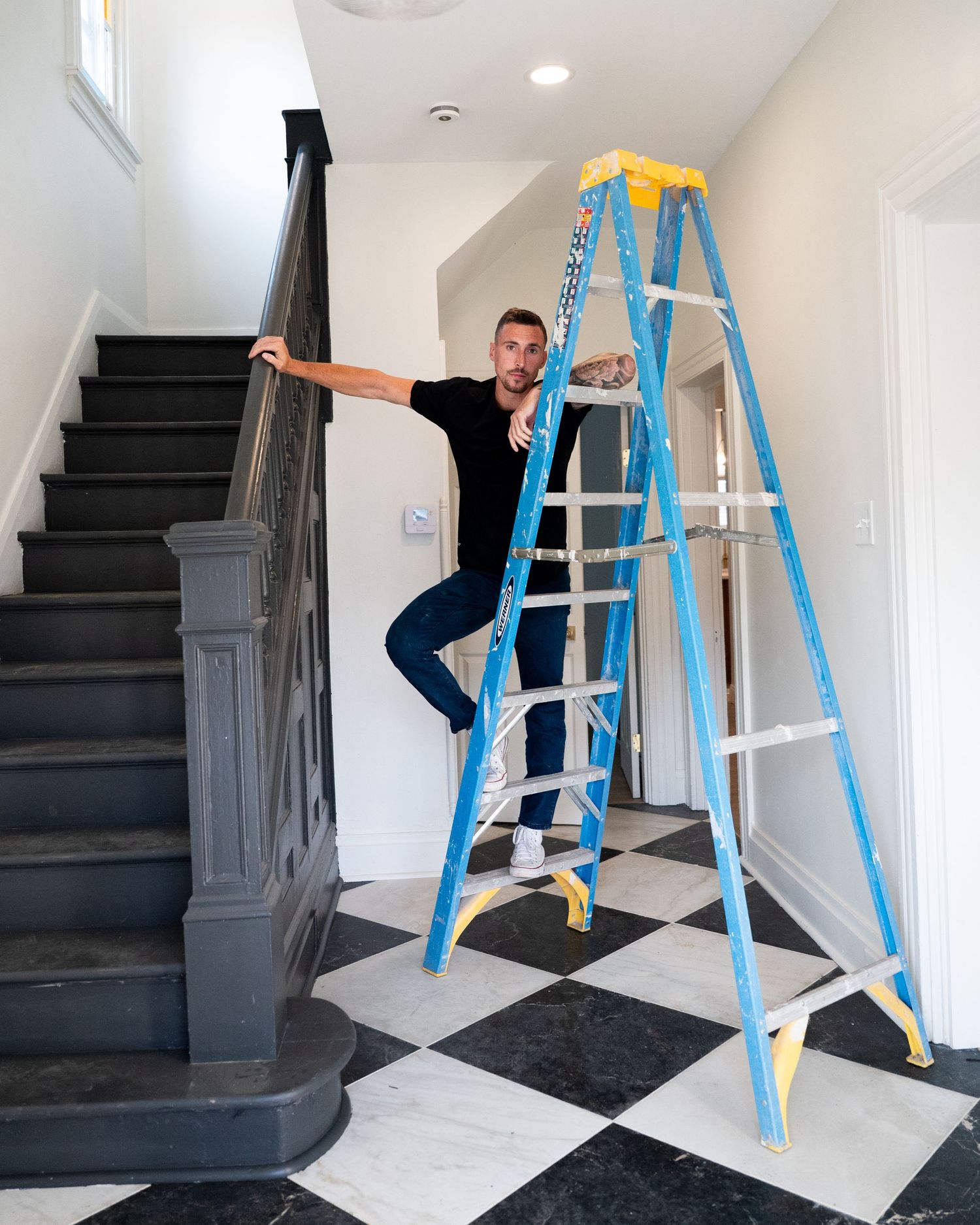 A sequence of images showing a ladder setup against dark stairs in a white hallway for home maintenance work.