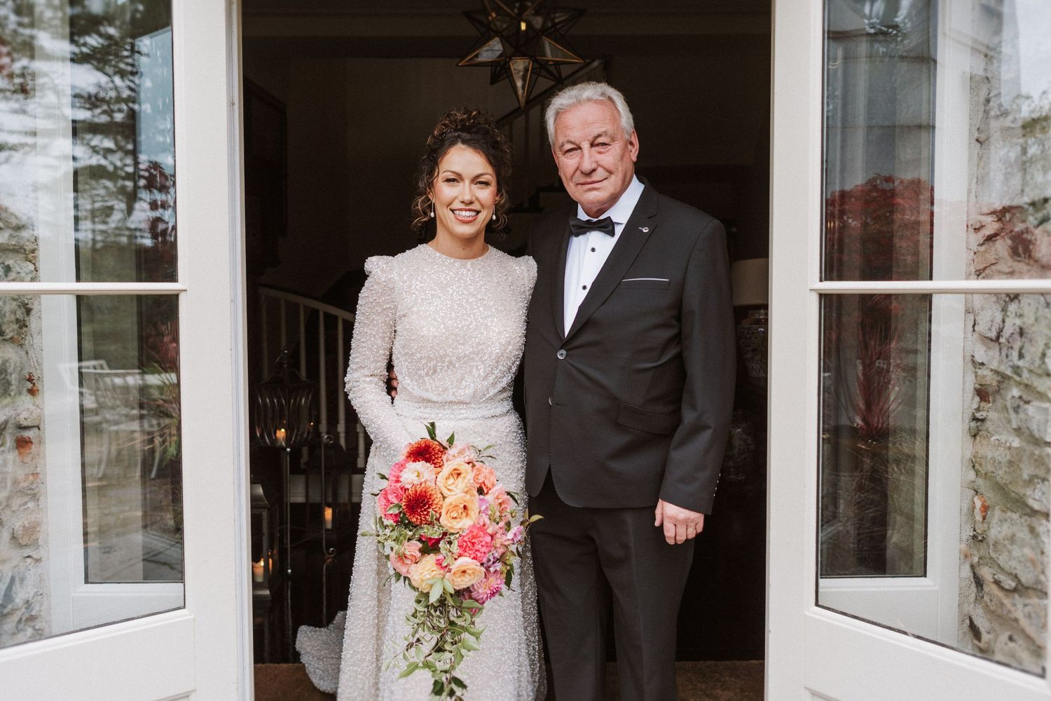 A black and white photo collage featuring a couple at their wedding reception.