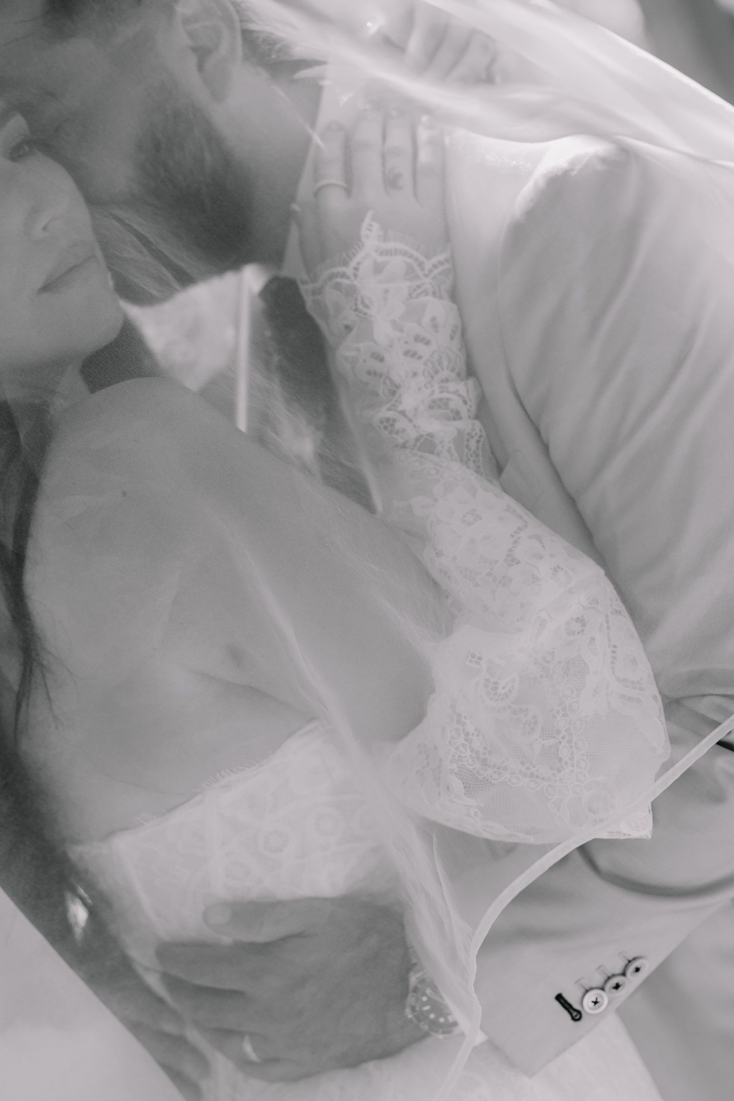 Intimate black and white wedding portraits showing tender moments between newlyweds.