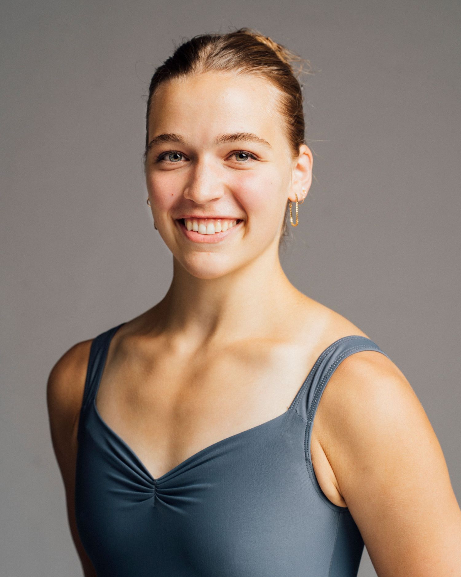 Professional Studio portrait of Chicago dancer headshot with natural smile for dance school applications.