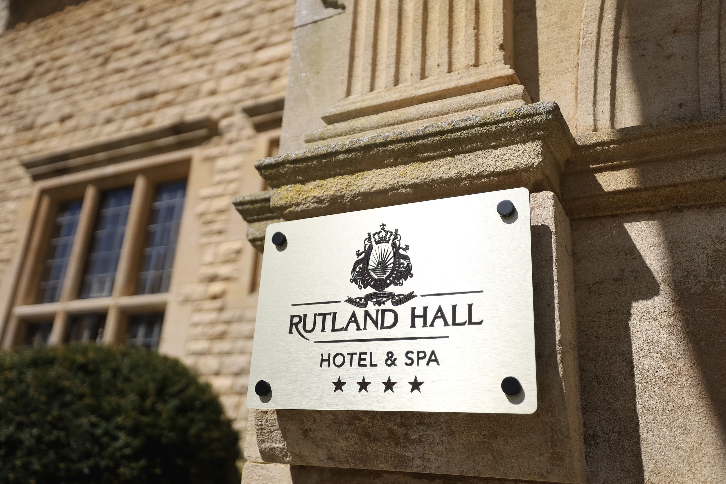 Close-up view of Rutland Hall Hotel & Spa signage showing four-star rating.