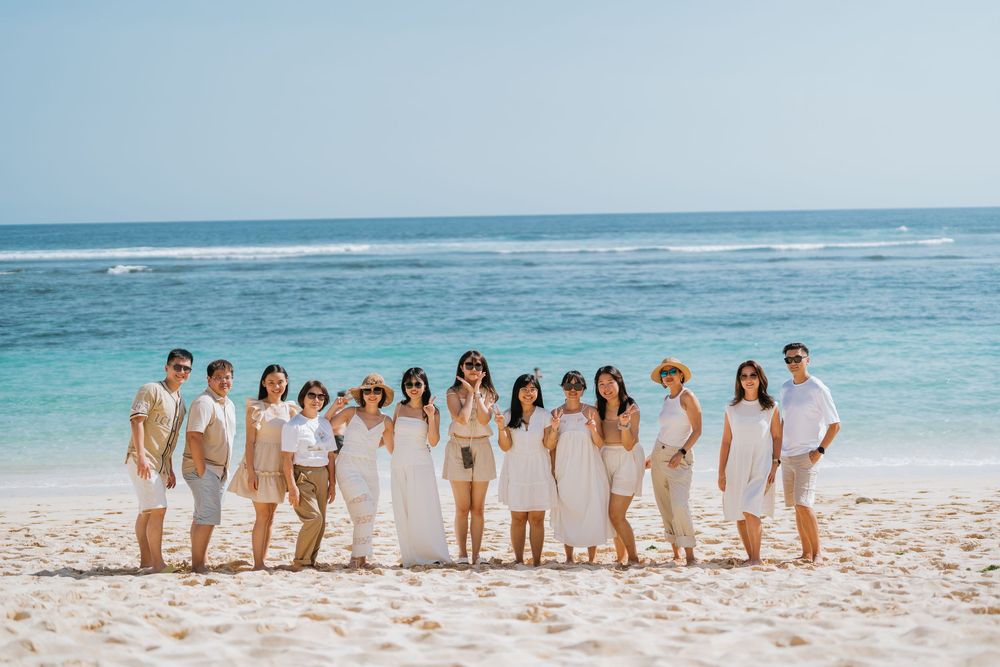 Group holiday photography services with a beach background.