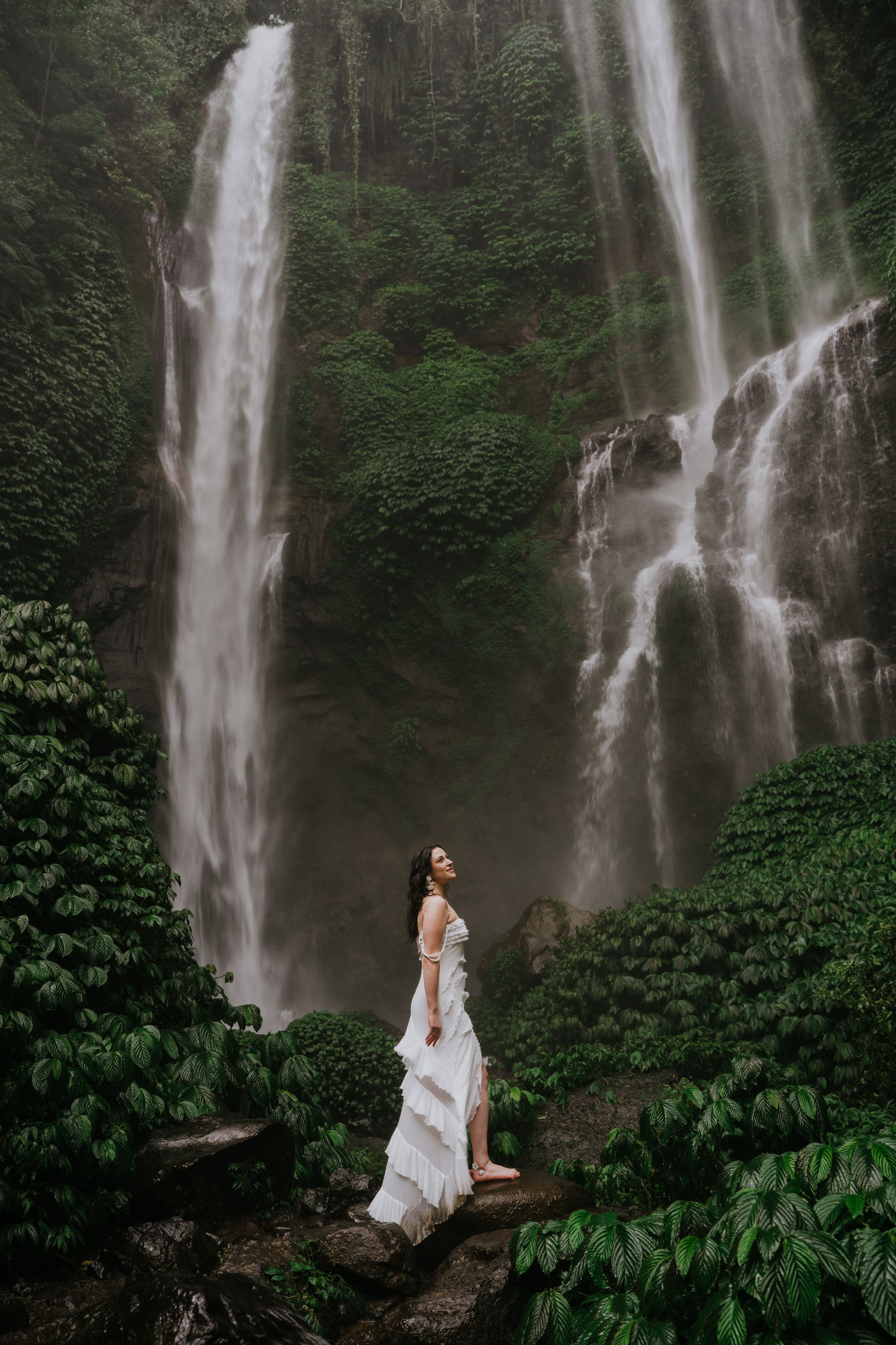 Natural lifestyle photoshoot showcasing a waterfall as the main background.