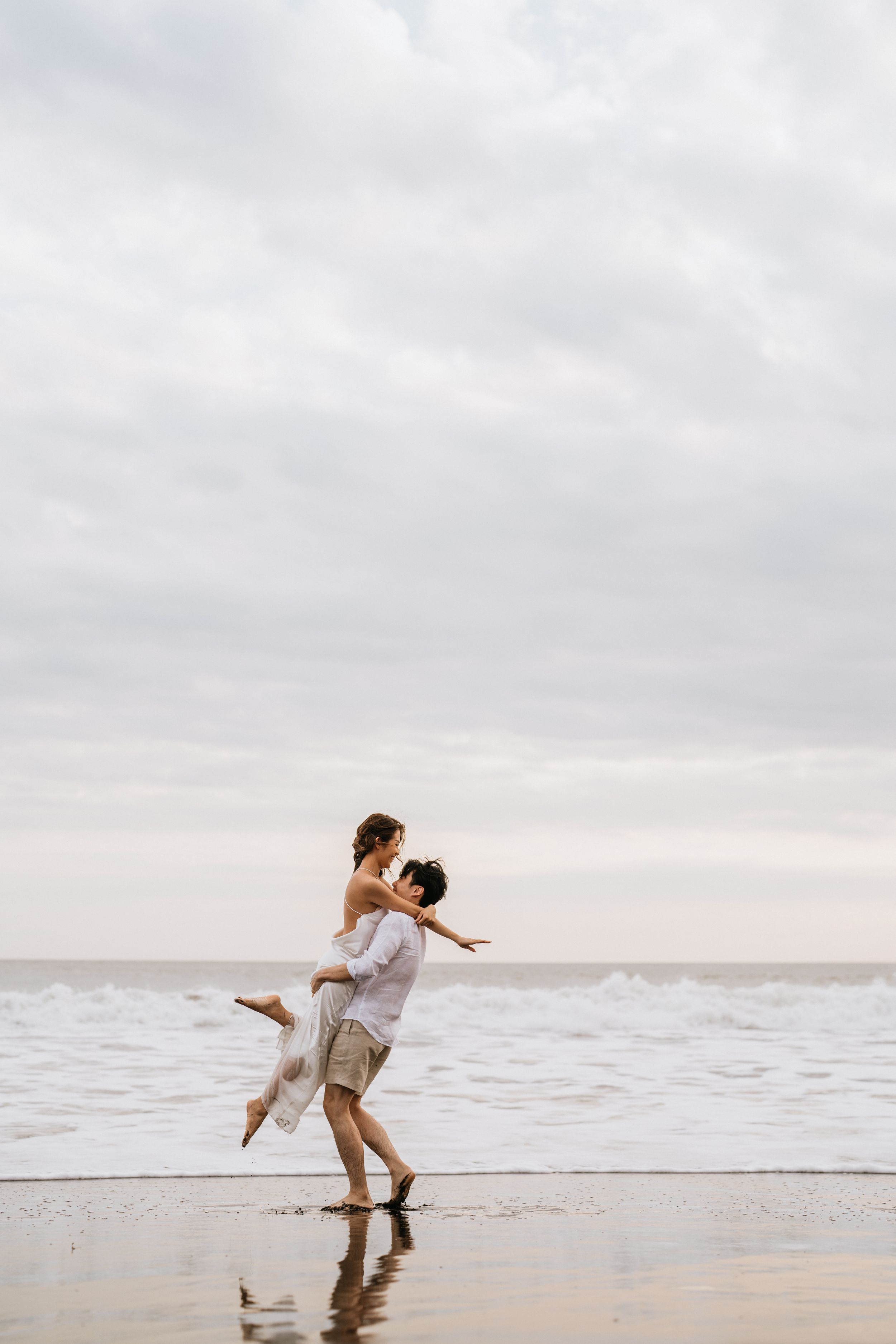 Professional prewedding photoshoot with natural beach ambience