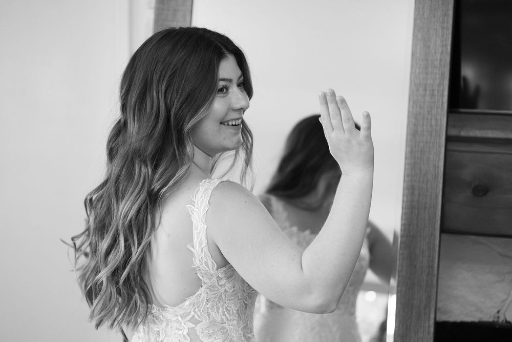 A side view of a dress with delicate lace details in black and white.