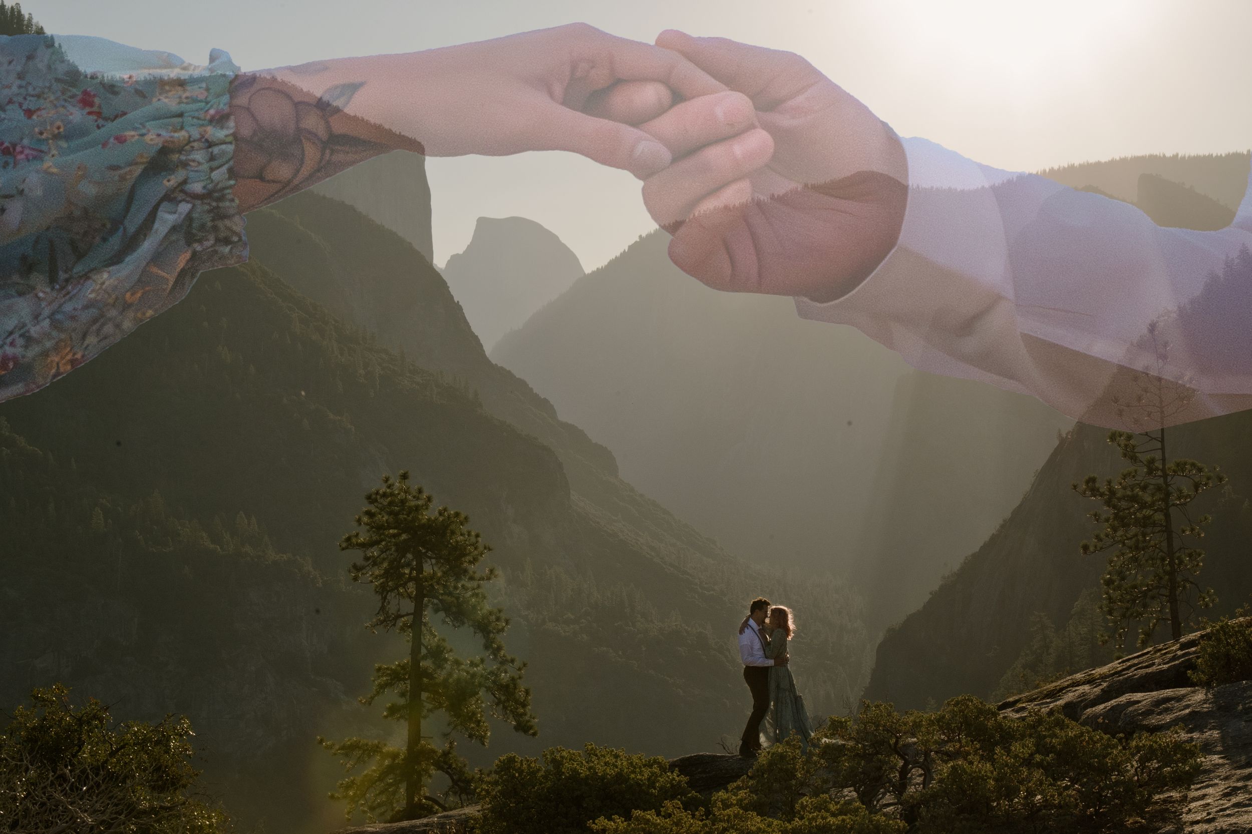 A couple poses atop a scenic mountain vista during sunset in Mount Rainier National Park.