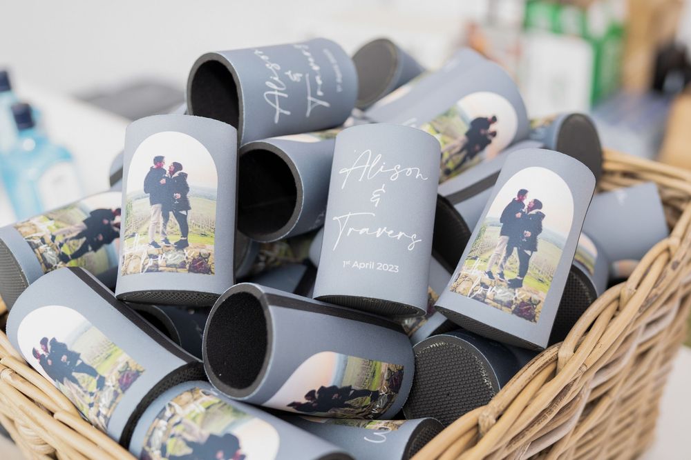 White ceramic coffee mugs with silhouette artwork designs arranged in a retail display setting.