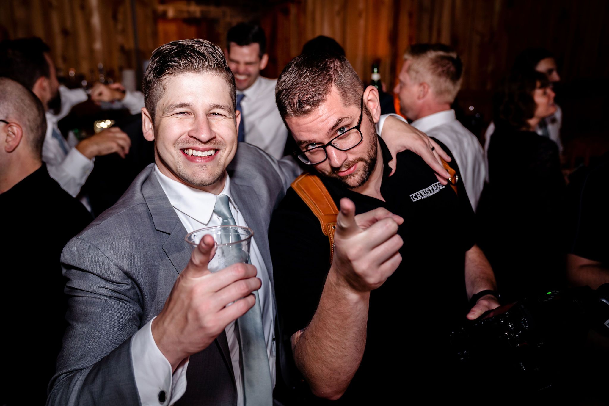 Lively reception celebration with guests dancing and enjoying the festivities.