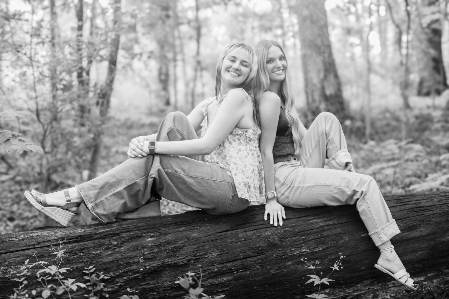 Outdoor senior photo of twin teens in Cincinnati natural setting with professional styling for high-end portrait clients black and white