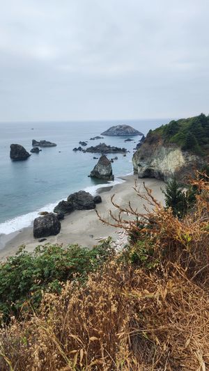 Scenic view of rugged rocks along the ocean’s edge.