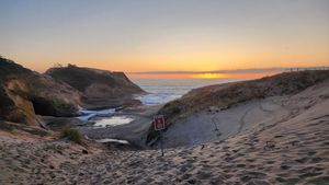 Sunset over sand dunes at the Oregon Coast.
