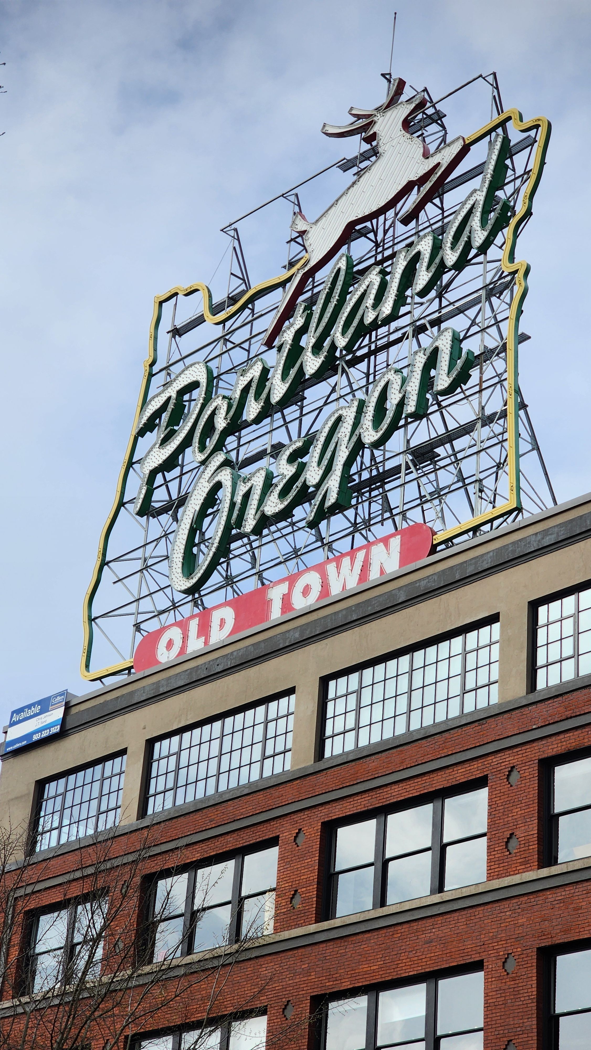Iconic Portland White Stag on top of a brick building in downtown Portland, Oregon.