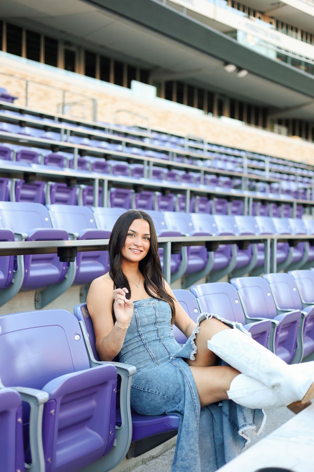 Purple stadium seats create a retro atmosphere for a casual photoshoot.