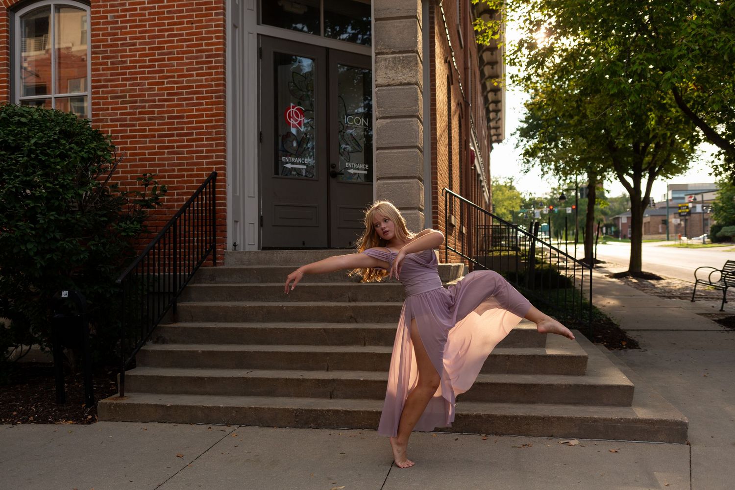 A series of dance poses captured in front of a brick building on a sunny afternoon.