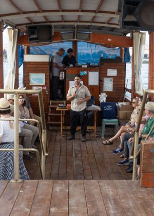 Photo of Tour Guide on a boat in the Sea of Galilee