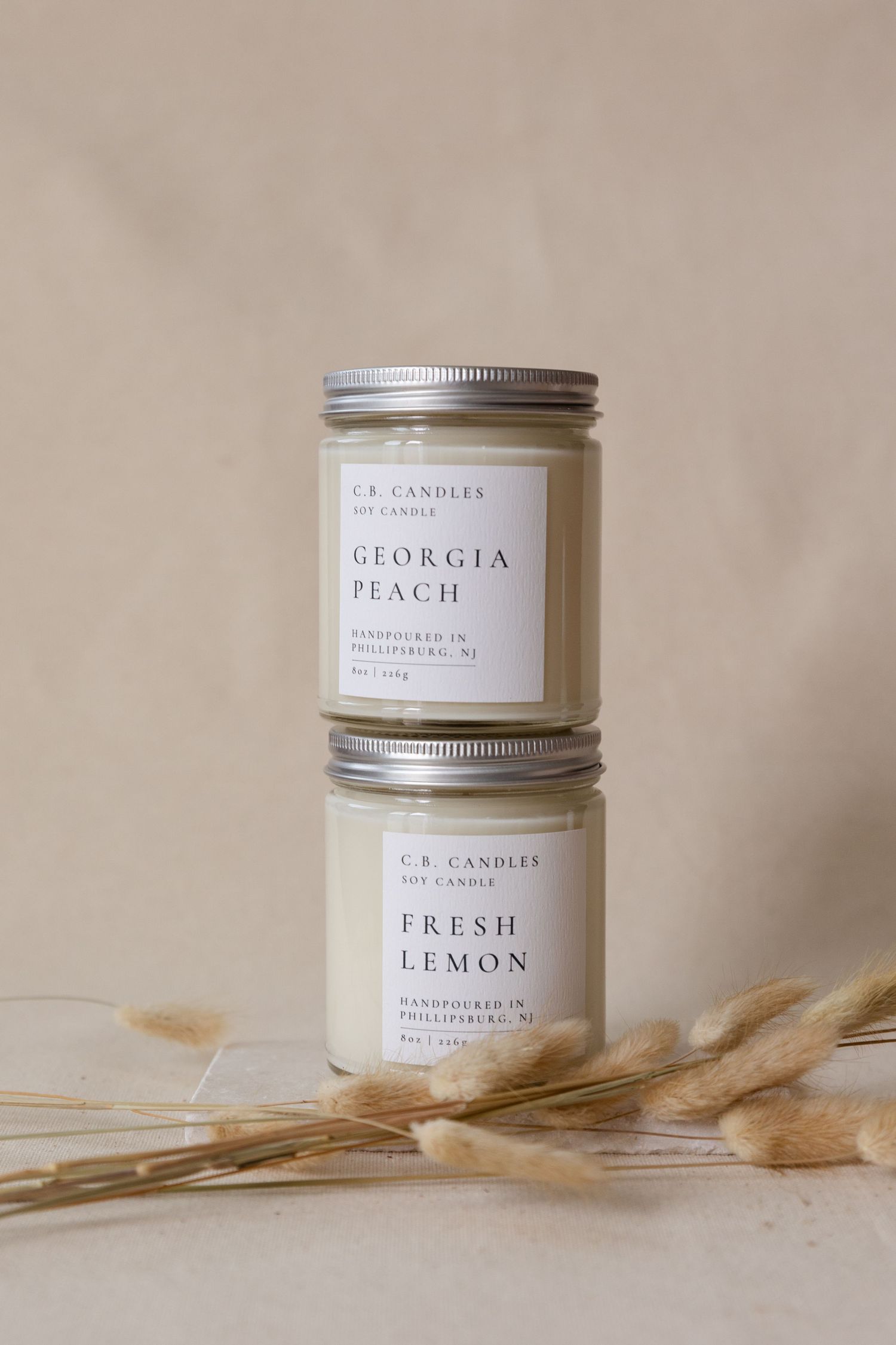 two candle jars on top of each other