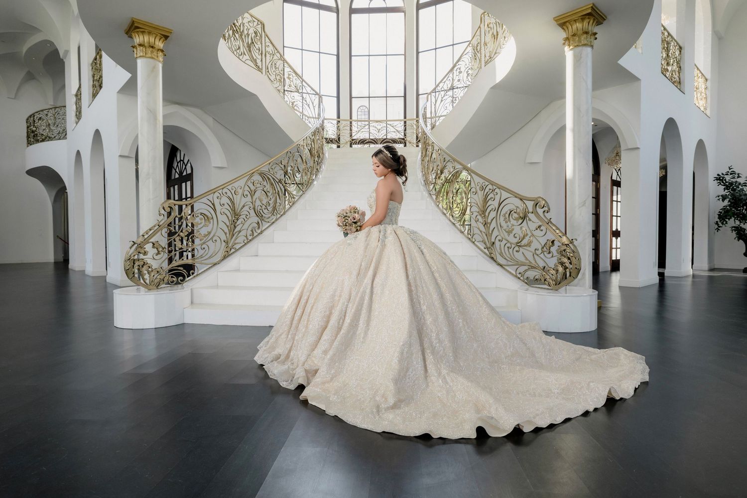 Panoramic series of a wedding dress swirling dramatically in an elegant white interior with arched windows.