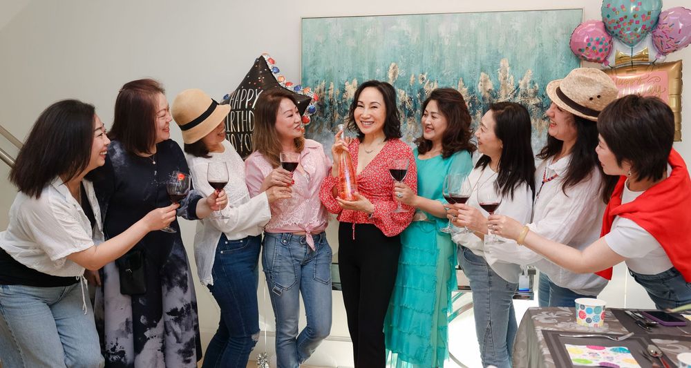 Vancouver Birthday Photographer capturing friends celebrating indoors