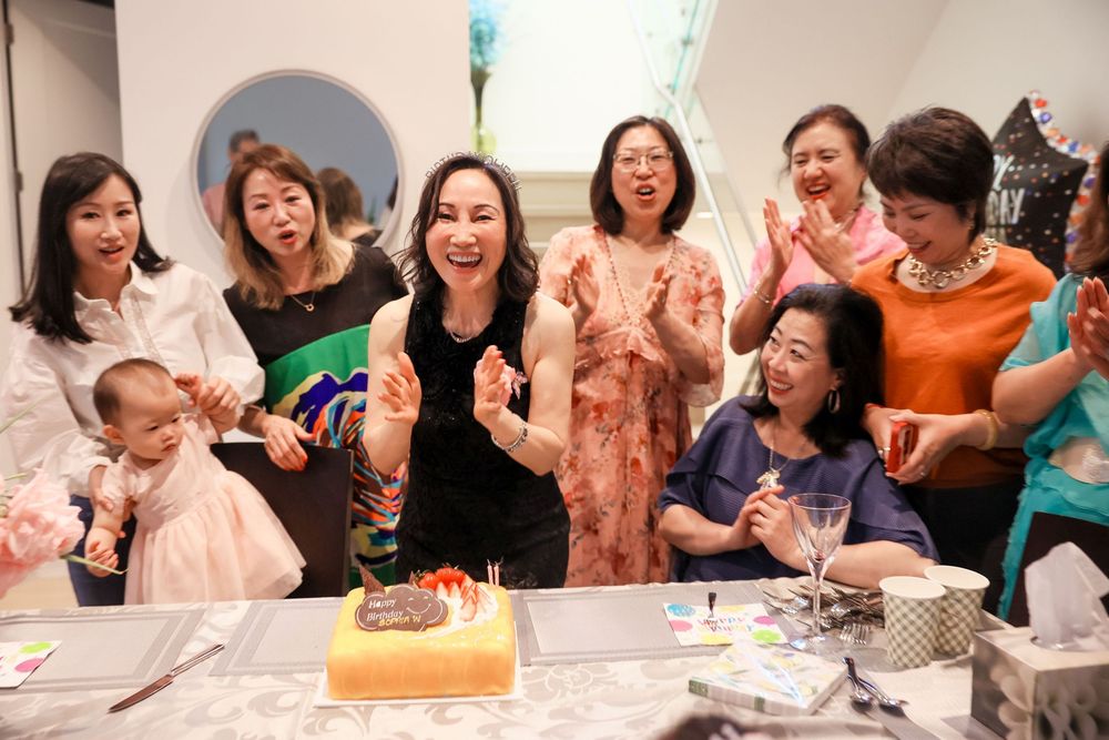 Vancouver Birthday Photographer capturing friends celebrating indoors
