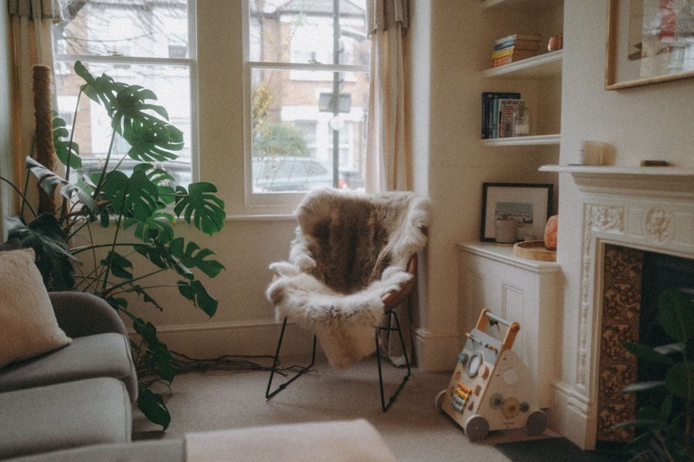 Arm chair with fleece throw in a loving room. Lifestyle photography