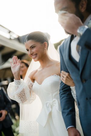 Wedding couple shares joyful laughter in candid sequence from an outdoor ceremony.