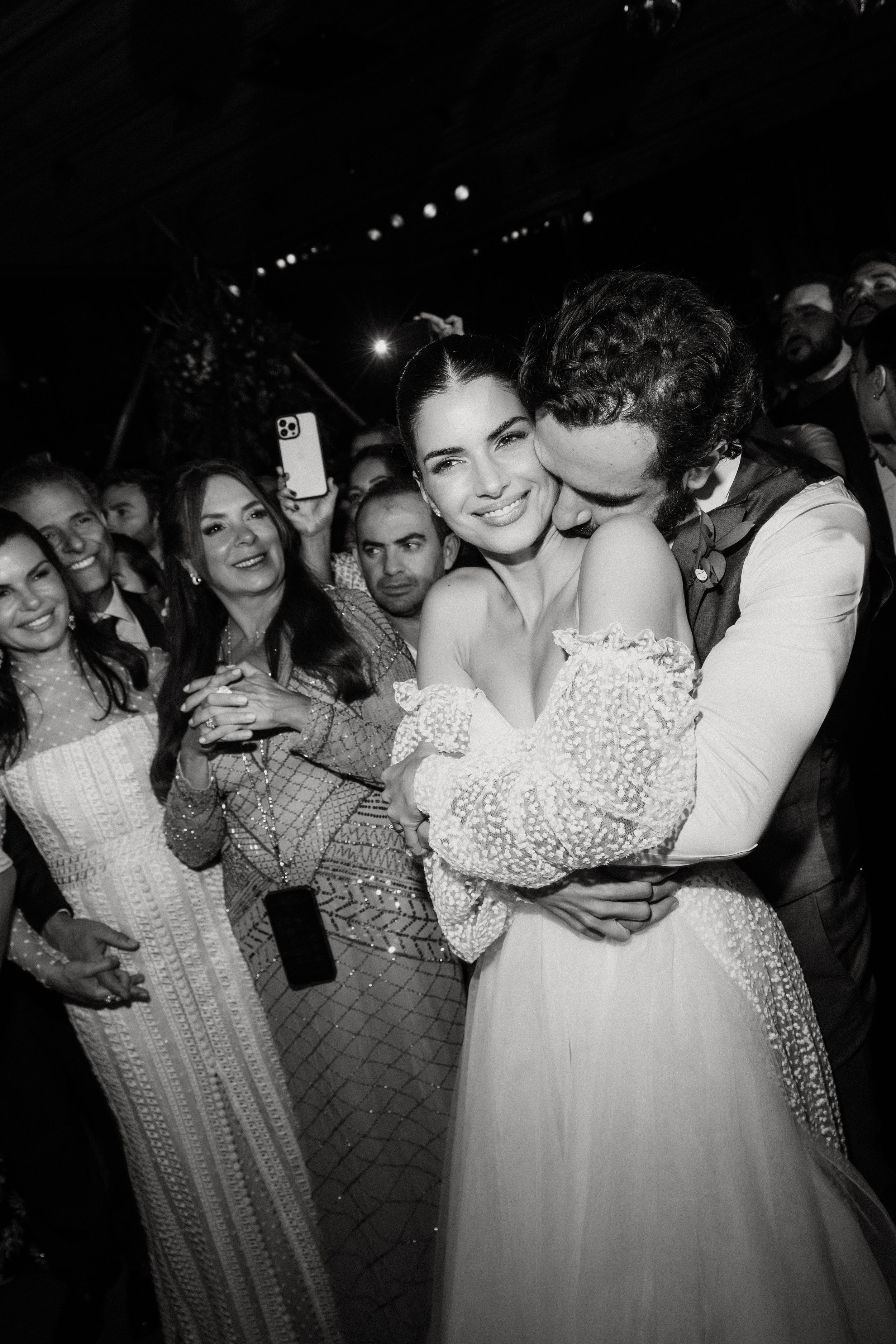 Black and white photos show couples dancing together at a nighttime celebration event.